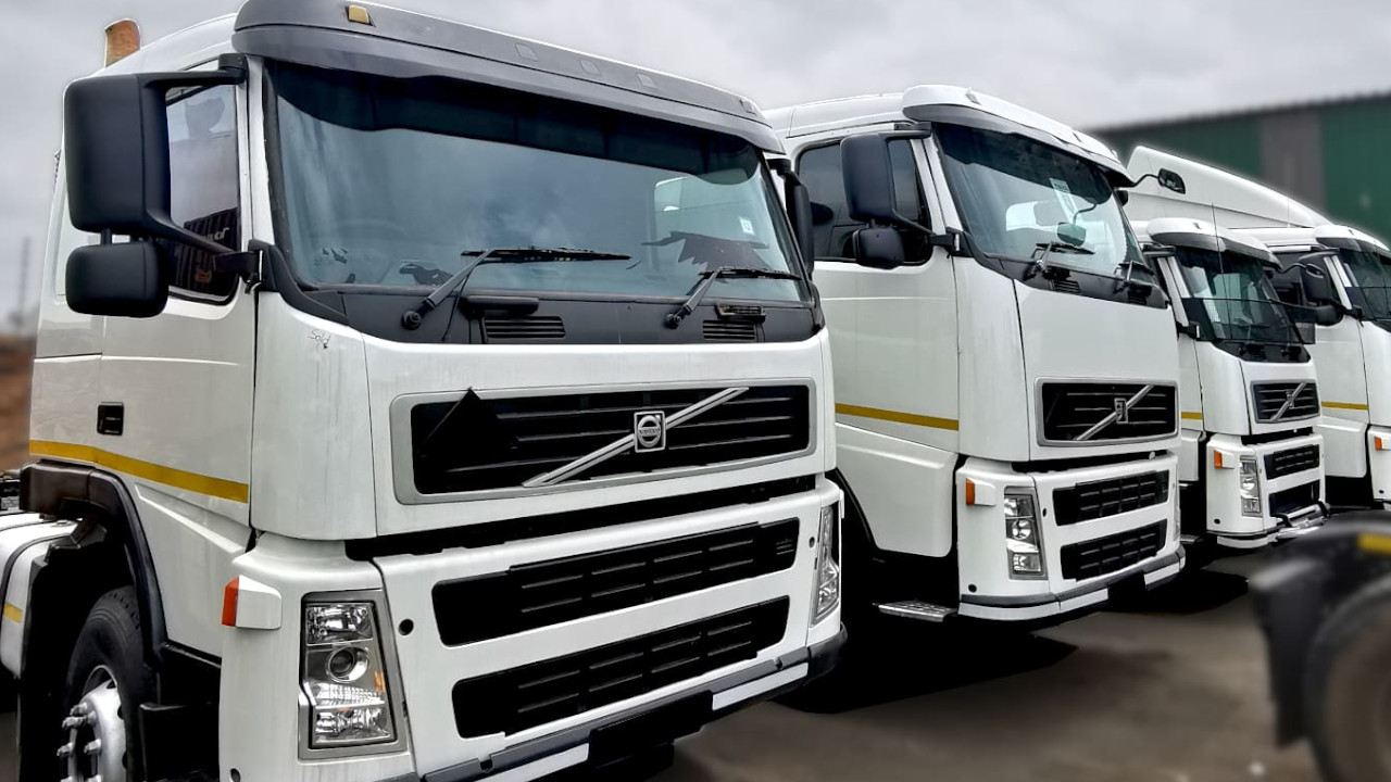 Multiple white Volvo FM 400 6x4 horses lined up for sale, ex-fleet units with full service history, South Africa