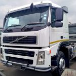 Volvo FM 400 6x4 horse angled view showing 400 badge, yellow reflective stripe and sunvisor, South Africa